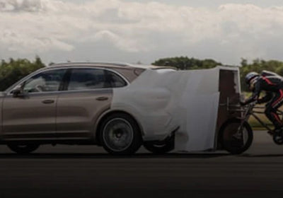 Image: Neil Campbell Hits New Speed Cycling Record From The Back of a Porsche